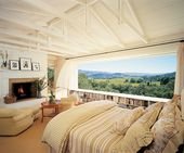 I love this room – an amazing view, a fireplace, bookshelves under the window an…