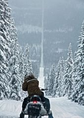 On the road to snow-where! Spectacular shots of snowmobilers riding snowy border between Sweden and Norway