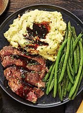 Ribeye and Roasted Garlic Pan Sauce with Mashed Potatoes and Green Beans